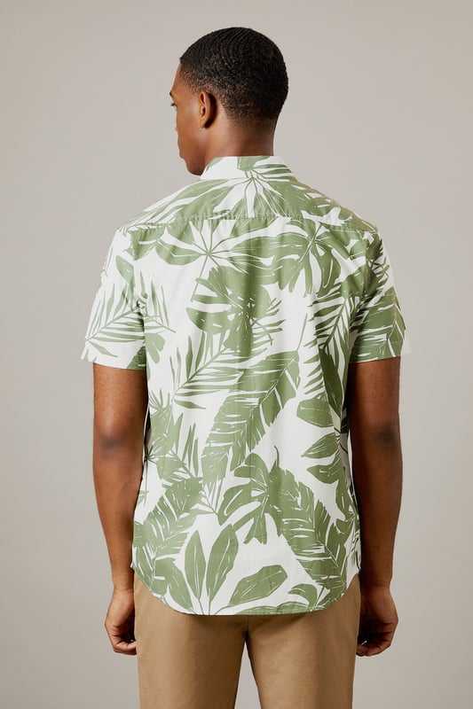 Bold leaf print design for a distinctive summer look
        Short sleeve construction with classic collar for casual comfort
        Button-through front with chest pocket detail
        Crafted from 100% cotton for breathable all-day wear
        Regular fit silhouette that suits most body types
    
    This Burton leaf print shirt brings a touch of tropical flair to your casual wardrobe without compromising on comfort. Perfect for warm-weather socialising, it pairs brilliantly with chino shorts and white trainers as shown for daytime pub garden gatherings. The versatile design works equally well with neutral trousers for evening drinks or family barbecues. The breathable cotton fabric ensures you'll stay comfortable throughout the day, whilst the classic cut maintains a smart-casual balance that Burton is known for. Layer under a lightweight bomber jacket when the temperature drops, or wear open over a plain white t-shirt for a relaxed weekend look. Machine washable at 30 degrees, this shirt combines practicality with effortless style for the modern British man who values both tradition and contemporary design.