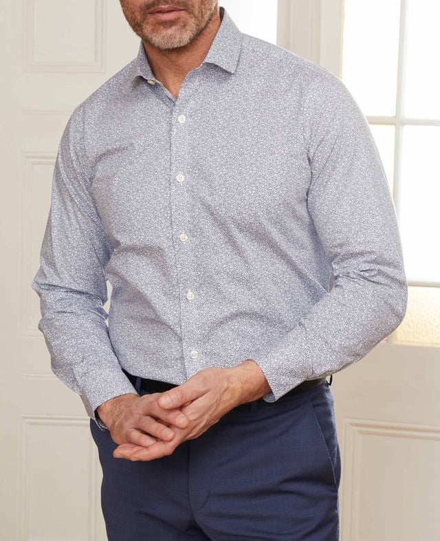 This printed slim fit shirt has been made from beautifully soft cotton with a hint of stretch to allow better movement and ultimate comfort. It's complete with our famous curl-resistant collar but has been given a shorter hem so you can wear it untucked.