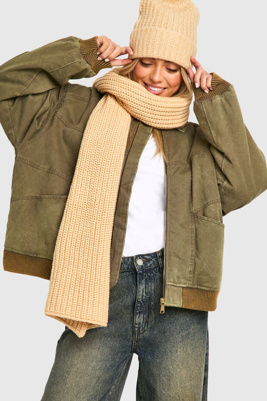 Chunky ribbed knit texture for added warmth and style
        Generous length for versatile wrapping and draping
        Classic rectangular shape suits various styling options
        Soft, cosy fabric blend for ultimate comfort
        Timeless design complements diverse outfits
    
    Wrap yourself in comfort and style with this long ribbed knit scarf from Boohoo. Perfect for brisk autumn days or chilly winter evenings, this versatile accessory adds a touch of cosiness to any ensemble. The chunky ribbed texture not only provides extra warmth but also creates a visually appealing pattern that catches the eye. Style it loosely draped over a casual jacket for a relaxed look, or wrap it snugly around your neck for maximum protection against the elements. Pair with jeans, trainers, and an oversized coat for an effortlessly chic everyday outfit. Whether you're heading to a casual coffee date or a weekend shopping trip, this scarf is the ideal finishing touch to your look, combining practicality with on-trend fashion sensibility.