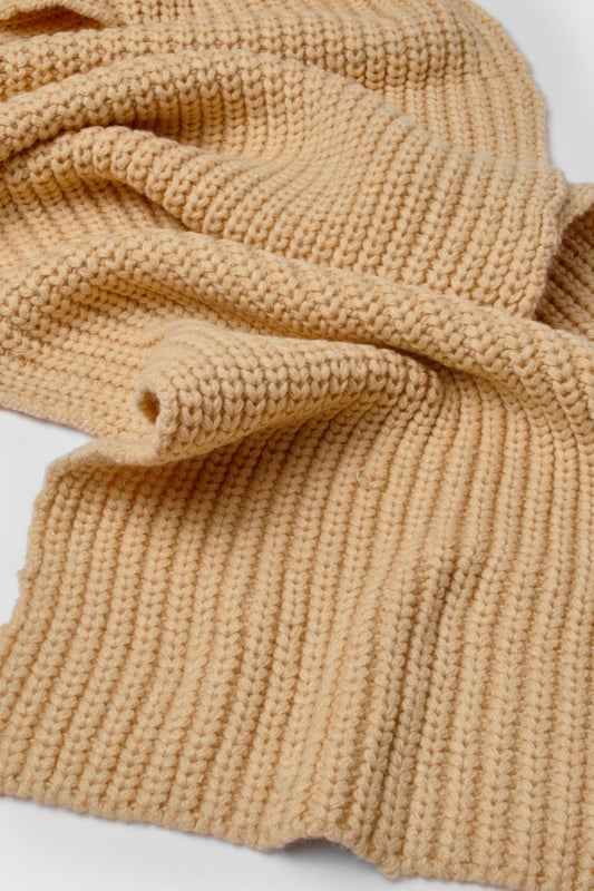 Chunky ribbed knit texture for added warmth and style
        Generous length for versatile wrapping and draping
        Classic rectangular shape suits various styling options
        Soft, cosy fabric blend for ultimate comfort
        Timeless design complements diverse outfits
    
    Wrap yourself in comfort and style with this long ribbed knit scarf from Boohoo. Perfect for brisk autumn days or chilly winter evenings, this versatile accessory adds a touch of cosiness to any ensemble. The chunky ribbed texture not only provides extra warmth but also creates a visually appealing pattern that catches the eye. Style it loosely draped over a casual jacket for a relaxed look, or wrap it snugly around your neck for maximum protection against the elements. Pair with jeans, trainers, and an oversized coat for an effortlessly chic everyday outfit. Whether you're heading to a casual coffee date or a weekend shopping trip, this scarf is the ideal finishing touch to your look, combining practicality with on-trend fashion sensibility.