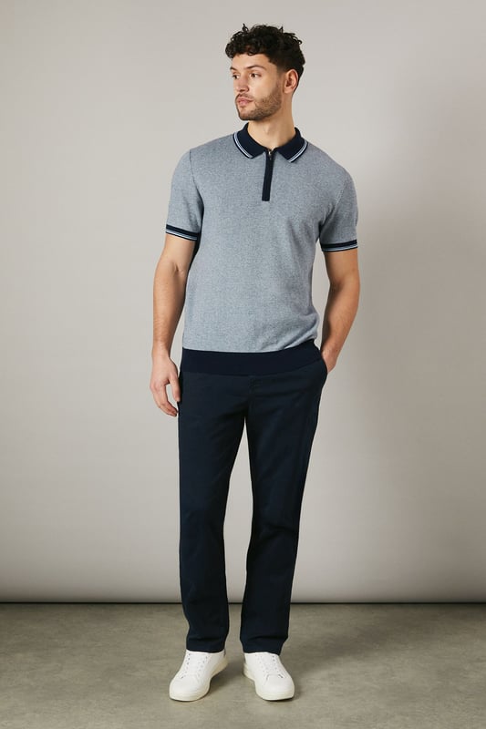 Birdseye knitted texture for a sophisticated look
        Contrasting collar and cuffs for a smart finish
        Quarter-zip neckline for adjustable comfort
        Short sleeves ideal for warmer weather
        Versatile design suitable for various casual occasions
    
    This Maine birdseye knitted polo shirt combines comfort with style, making it a versatile addition to your wardrobe. The textured knit adds depth and interest to the garment, while the contrasting collar and cuffs create a refined edge. Perfect for casual outings, this polo can be effortlessly styled for a range of events. Pair it with dark trousers and white trainers for a smart-casual look ideal for family gatherings or weekend brunches. The quarter-zip neckline allows for customisable comfort, adapting to your preference and the weather. Made from 100% cotton, this polo ensures breathability and ease of care, making it a practical choice for the modern man who values both style and functionality. Whether you're heading to a casual meet-up with friends or a relaxed day out, this Maine polo will keep you looking polished without compromising on comfort.