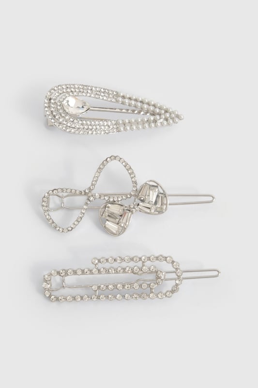 Set of three versatile hair clips
        Adorned with sparkling diamante detailing
        Varied designs for multiple styling options
        Secure snap closure for easy application
        Ideal for adding a touch of glamour to any hairstyle
    
    Elevate your hair game with this stunning trio of diamante-encrusted hair clips. Perfect for those nights out when you want to add a bit of sparkle to your look, these versatile accessories can be worn individually or combined for maximum impact. Whether you're heading to the club, meeting friends for drinks, or embarking on a night of urban adventure, these clips will ensure your hair is on point. Style them with sleek straight locks for a modern edge, or use them to secure an elegant updo for a more sophisticated vibe. The varied designs offer endless styling possibilities, allowing you to customise your look to suit any outfit or occasion. These hair clips are the perfect finishing touch to transform your ensemble from day to night, adding that extra bit of glitz that will have you shining on the dance floor.