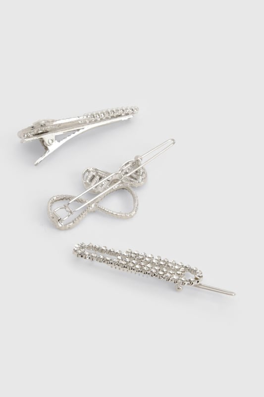 Set of three versatile hair clips
        Adorned with sparkling diamante detailing
        Varied designs for multiple styling options
        Secure snap closure for easy application
        Ideal for adding a touch of glamour to any hairstyle
    
    Elevate your hair game with this stunning trio of diamante-encrusted hair clips. Perfect for those nights out when you want to add a bit of sparkle to your look, these versatile accessories can be worn individually or combined for maximum impact. Whether you're heading to the club, meeting friends for drinks, or embarking on a night of urban adventure, these clips will ensure your hair is on point. Style them with sleek straight locks for a modern edge, or use them to secure an elegant updo for a more sophisticated vibe. The varied designs offer endless styling possibilities, allowing you to customise your look to suit any outfit or occasion. These hair clips are the perfect finishing touch to transform your ensemble from day to night, adding that extra bit of glitz that will have you shining on the dance floor.