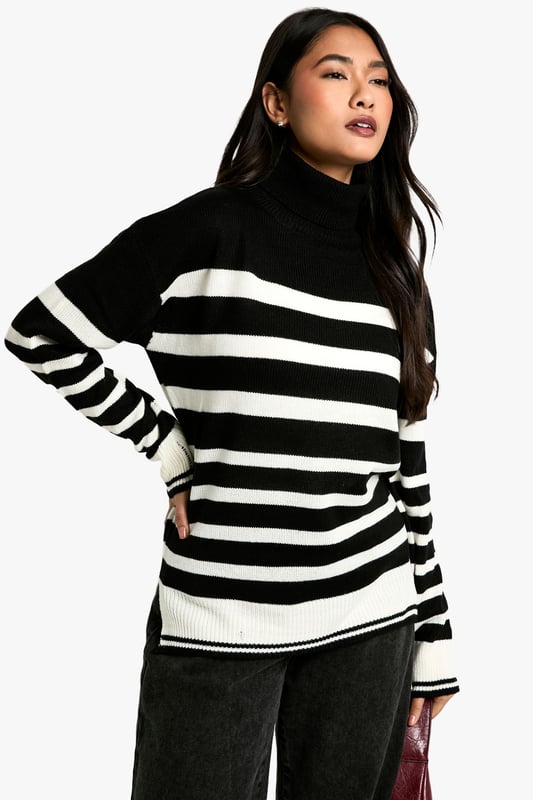 Bold striped pattern for a striking visual impact
        Cosy roll neck design for extra warmth
        Long sleeves with ribbed cuffs for a snug fit
        Relaxed silhouette for comfortable everyday wear
        Versatile design suitable for various casual occasions
    
    Make a statement with this eye-catching Stripe Roll Neck Jumper from Boohoo. The bold contrast between the stripes creates a captivating look that's sure to turn heads. Perfect for the fashion-forward woman who loves to stay on-trend, this jumper offers both style and comfort. The roll neck provides extra warmth on chilly days, while the relaxed fit ensures ease of movement. Style it with wide-leg trousers and chunky boots for a contemporary casual look, or pair it with a midi skirt and trainers for a chic weekend ensemble. Ideal for family gatherings, coffee dates with friends, or casual outings, this jumper is a versatile addition to your wardrobe that can be dressed up or down with ease. Its timeless design ensures it will remain a favourite for seasons to come.