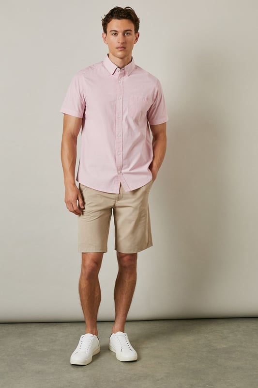 Fine stripe pattern adds subtle visual interest to this classic short sleeve shirt
        Button-down collar provides a neat, structured finish
        Convenient chest pocket detail for added functionality
        Crafted from pure cotton for breathable comfort in warmer weather
        Regular fit design offers ease of movement for everyday wear
    
    This Maine short sleeve shirt combines timeless style with warm-weather practicality. The fine stripe pattern creates a refined yet relaxed aesthetic that transitions effortlessly from day to evening occasions. Style it as seen with neutral chino shorts and white trainers for a polished casual look perfect for weekend brunches or garden gatherings. For smarter occasions, pair with tailored trousers and loafers. The pure cotton fabric ensures all-day comfort even during the warmest days, while the versatile design makes it an essential addition to your summer wardrobe. The button-down collar maintains a neat appearance throughout wear, making this shirt equally suitable for casual office environments or laid-back social events. A true wardrobe staple that offers endless styling possibilities throughout the season.