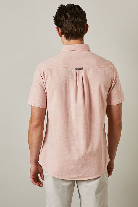 Textured woven fabric with subtle surface interest for added dimension
        Classic button-down collar for a smart-casual finish
        Convenient chest pocket detail for practical styling
        Short sleeves with neat hems perfect for warmer days
        Centre back pleat providing enhanced comfort and movement
    
    This Maine textured short sleeve shirt combines relaxed comfort with understated style. The button-down collar offers a refined touch whilst maintaining a laid-back feel, making it ideal for casual settings. Style as shown with light-coloured chino shorts and white trainers for effortless summer outings, or pair with tailored trousers for garden parties and family gatherings. The textured fabric adds subtle character to your ensemble without overwhelming it. For cooler evenings, layer under a lightweight bomber jacket or cardigan. This versatile shirt transitions seamlessly from daytime casual to evening drinks, making it an essential addition to your warm-weather wardrobe. The relaxed fit ensures all-day comfort whilst maintaining a put-together appearance that works across multiple settings.