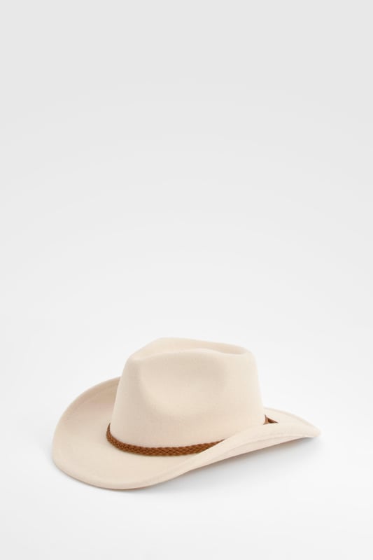 Classic cowboy hat silhouette with a wide brim
        Distinctive braided detail around the crown
        Decorative tassel accent for added flair
        Structured design maintains shape
        Versatile accessory for various casual outfits
    
    Channel your inner cowgirl with this eye-catching Western-inspired hat. The braided detail and playful tassel add a touch of bohemian charm to the classic cowboy silhouette. Perfect for festivals, outdoor events, or simply adding a dash of Wild West flair to your everyday look. Style it with a denim waistcoat and distressed shorts for a carefree summer ensemble, or pair it with a flowing maxi dress for a more romantic take on festival fashion. This hat is not just an accessory; it's a statement piece that will transform your casual outfits into head-turning looks. Whether you're heading to a family barbecue or a day out with friends, this versatile hat will keep you stylish and shaded in equal measure.