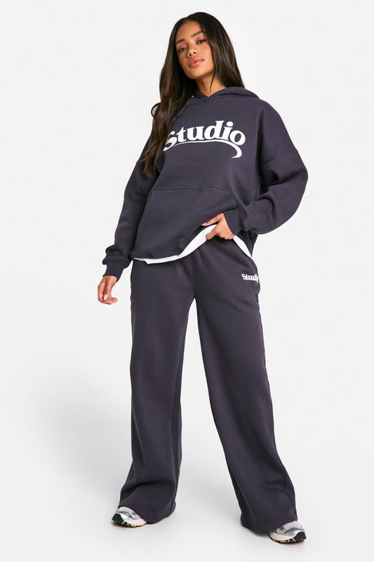 Oversized fit for ultimate comfort and style
        Bold 'Studio' slogan print across the chest
        Spacious hood for added warmth and casual flair
        Convenient front pocket for essentials
        Ribbed cuffs and hem for a snug fit
    
    Make a statement in this trendy oversized hoodie, perfect for those who love to combine comfort with street-style edge. The bold 'Studio' slogan across the chest adds a touch of urban cool to your casual wardrobe. Pair it with wide-leg trousers and trainers for a relaxed weekend look, or throw it over cycling shorts and chunky boots for an edgy athleisure vibe. Ideal for lazy Sundays, coffee runs, or casual meet-ups with friends, this hoodie is versatile enough to take you from daytime errands to evening chill-outs. Layer it over a long-sleeved tee for extra warmth during cooler months, or wear it solo as a comfy throw-on piece. The oversized fit allows for easy movement, making it a go-to choice for your active lifestyle. Whether you're heading to the gym, running errands, or simply lounging at home, this hoodie promises to keep you stylish and cosy all day long.