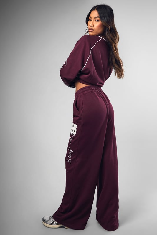 Wide-leg design for ultimate comfort and style
        Bold '66' graphic print on leg
        Coordinating sweatshirt available for a matching set
        Relaxed fit perfect for lounging or casual outings
        Versatile piece that can be dressed up or down
    
    Make a statement in these eye-catching Dsgn Sport 66 wide-leg joggers from Boohoo. Perfect for the fashion-forward woman who values both style and comfort, these joggers offer a relaxed fit with a trendy wide-leg silhouette. The standout '66' graphic print adds a sporty edge, whilst the soft cotton blend fabric ensures all-day comfort. Style these versatile joggers with the matching sweatshirt for a coordinated look, or mix and match with a cropped tee and trainers for a more casual vibe. Ideal for lazy weekends, running errands, or meeting friends for coffee, these joggers effortlessly blend athleisure with street style. For a more polished look, pair with a fitted bodysuit and chunky jewellery. Whatever the occasion, these Dsgn Sport 66 joggers are sure to become a go-to piece in your wardrobe.
