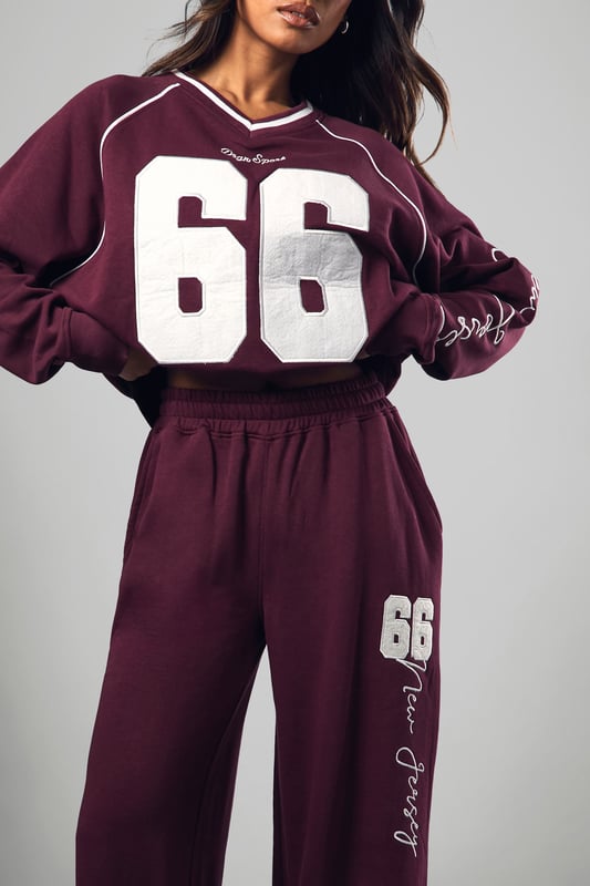 Wide-leg design for ultimate comfort and style
        Bold '66' graphic print on leg
        Coordinating sweatshirt available for a matching set
        Relaxed fit perfect for lounging or casual outings
        Versatile piece that can be dressed up or down
    
    Make a statement in these eye-catching Dsgn Sport 66 wide-leg joggers from Boohoo. Perfect for the fashion-forward woman who values both style and comfort, these joggers offer a relaxed fit with a trendy wide-leg silhouette. The standout '66' graphic print adds a sporty edge, whilst the soft cotton blend fabric ensures all-day comfort. Style these versatile joggers with the matching sweatshirt for a coordinated look, or mix and match with a cropped tee and trainers for a more casual vibe. Ideal for lazy weekends, running errands, or meeting friends for coffee, these joggers effortlessly blend athleisure with street style. For a more polished look, pair with a fitted bodysuit and chunky jewellery. Whatever the occasion, these Dsgn Sport 66 joggers are sure to become a go-to piece in your wardrobe.