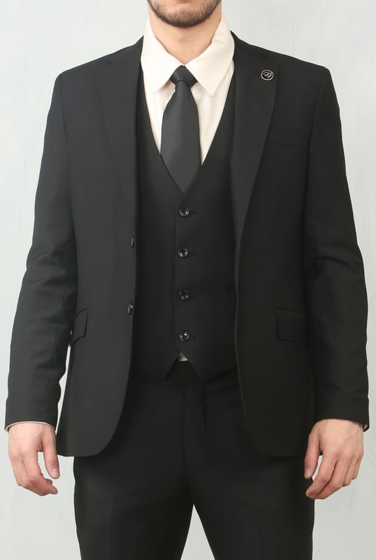 Step into timeless elegance with this tailored black 3-piece suit, designed to deliver both sophistication and comfort for any formal occasion. The classic plain black design ensures versatility across events—from weddings and proms to business meetings and evening functions. Expert tailoring offers a flattering, structured fit, while subtle stitch lapel detailing adds a refined touch. Complete with a blazer, waistcoat, and trousers, this suit is your go-to choice for a polished and confident look.\nTailored Fit: Structured for a modern silhouette that blends style and comfort.\nClassic Plain Black Design: Sleek and versatile, perfect for formal and professional events.\nComplete 3-Piece Set: Includes blazer, waistcoat, and trousers for a coordinated look.\nStitch Lapel Detailing: Adds subtle refinement and character to the overall design.\nMaterial Composition: 65% Polyester, 32% Viscose, 3% Lycra.