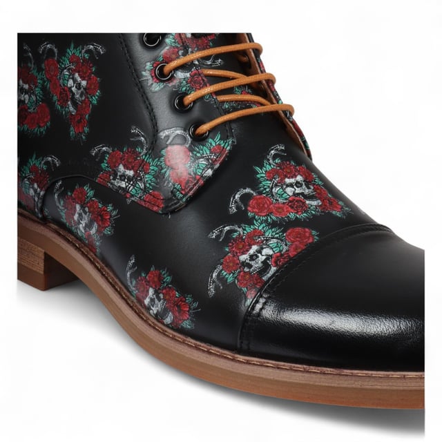 Elevate your style with the Justin Reess Adam Skull Men's Floral Skull Print Leather Oxford Ankle Boots. Crafted from premium leather, these boots showcase a distinctive Floral Skull Print design that adds a bold and fashionable edge. With classic Oxford brogue detailing and a secure lace-up closure, they bring sophistication to both casual and formal outfits. Designed for versatility, they’re perfect for work, social gatherings, and everyday wear. Durable and comfortable, these boots are a standout addition to any wardrobe.

Stylish Floral Skull Print for a unique and eye-catching look
Classic Oxford Brogue Style with lace-up closure
Premium Leather Construction for durability and comfort
Versatile Wear for multiple occasions