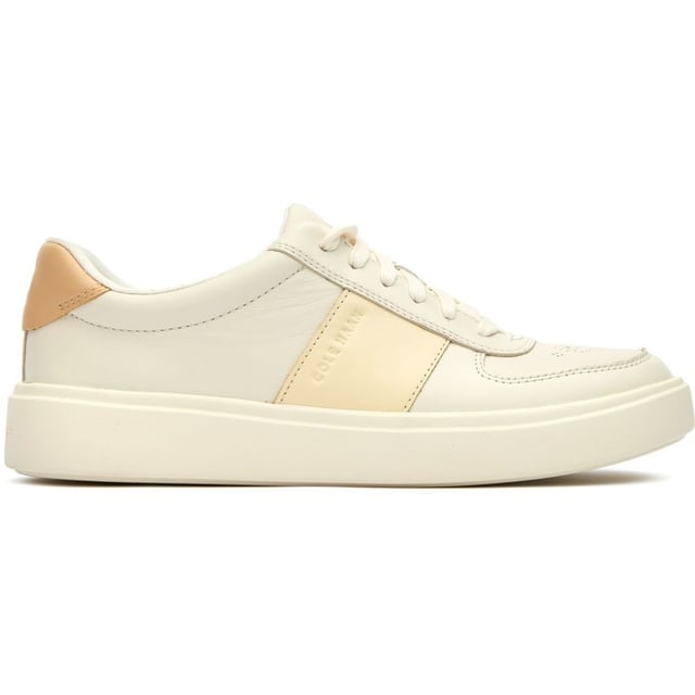 Womens white Cole Haan grand court della trainers and a rubber sole. Featuring: high traction rubber outsole, fabric covered, foam midsole and branding to heel and quarter.