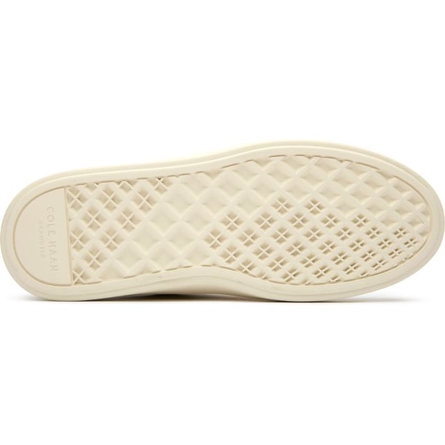 Womens white Cole Haan grand court della trainers and a rubber sole. Featuring: high traction rubber outsole, fabric covered, foam midsole and branding to heel and quarter.