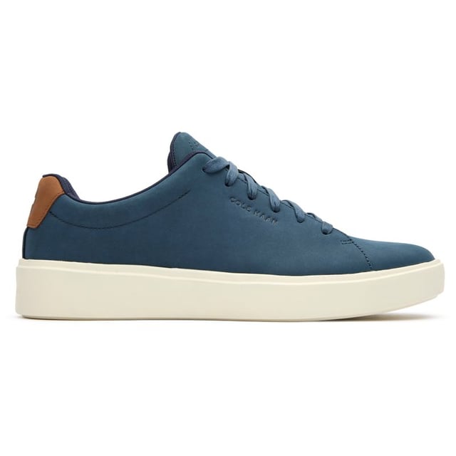 Mens blue Cole Haan grand crosscourt traveler trainers, manufactured with leather and a rubber sole. Featuring: cushioned footbed, durable rubber cupsole, soft leather upper, cole haan branding and comfort fit.