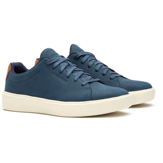 Mens blue Cole Haan grand crosscourt traveler trainers, manufactured with leather and a rubber sole. Featuring: cushioned footbed, durable rubber cupsole, soft leather upper, cole haan branding and comfort fit.