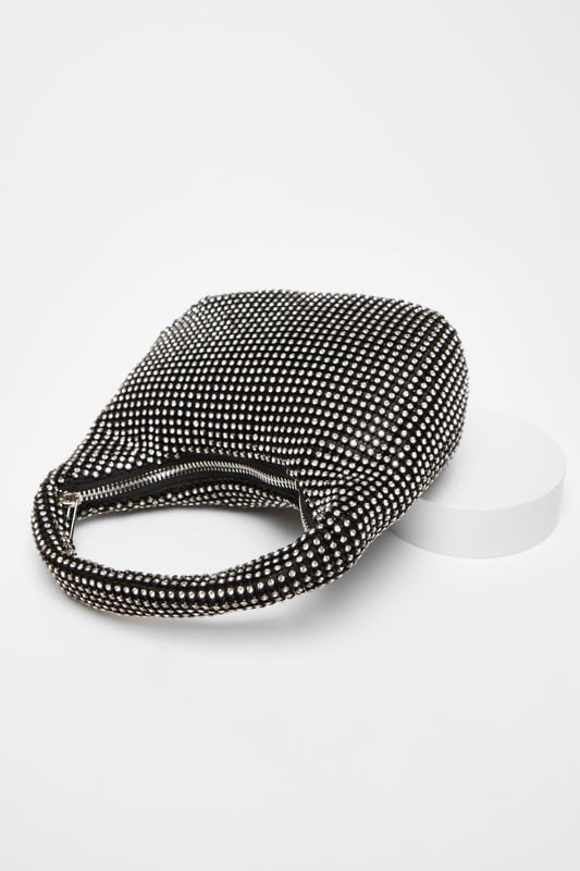- Diamante embellished - Pouch style - Top handle - Zip top closure - Rhinestone - Metals