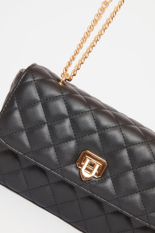 - Faux leather - Quilted design - Cross body style - Chain strap - Excluding trims