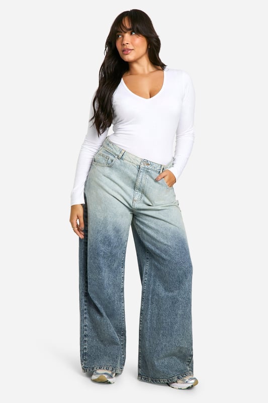 Plunge neckline for a daring look
        Long sleeves for versatile styling
        Figure-hugging bodysuit design
        Soft cotton blend fabric for comfort
        Plus size fit for inclusive fashion
    
    This long-sleeved bodysuit is a wardrobe essential that combines style and comfort effortlessly. The plunging neckline adds a touch of allure, making it perfect for both day and night looks. Pair it with high-waisted wide-leg jeans and trainers for a casual daytime ensemble, or dress it up with a sleek midi skirt and heels for evening drinks. The cotton blend fabric ensures breathability and ease of movement, ideal for long days out or cosy nights in. Its versatility shines through as it can be layered under a blazer for a smart-casual office look or worn solo for a night out dancing. This bodysuit is a true fashion chameleon, adapting to your style needs for any casual occasion, from family gatherings to impromptu coffee dates with friends.