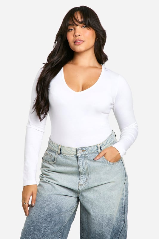 Plunge neckline for a daring look
        Long sleeves for versatile styling
        Figure-hugging bodysuit design
        Soft cotton blend fabric for comfort
        Plus size fit for inclusive fashion
    
    This long-sleeved bodysuit is a wardrobe essential that combines style and comfort effortlessly. The plunging neckline adds a touch of allure, making it perfect for both day and night looks. Pair it with high-waisted wide-leg jeans and trainers for a casual daytime ensemble, or dress it up with a sleek midi skirt and heels for evening drinks. The cotton blend fabric ensures breathability and ease of movement, ideal for long days out or cosy nights in. Its versatility shines through as it can be layered under a blazer for a smart-casual office look or worn solo for a night out dancing. This bodysuit is a true fashion chameleon, adapting to your style needs for any casual occasion, from family gatherings to impromptu coffee dates with friends.