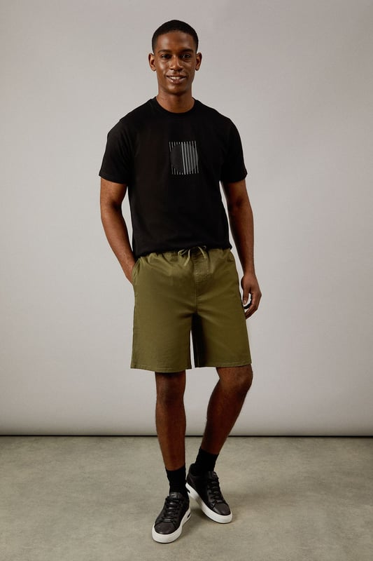 Distinctive eclipse print graphic on the chest for a modern, understated look
        Classic crew neck design offers timeless appeal and everyday comfort
        Short sleeves with clean-finished edges for a neat, polished appearance
        Soft jersey fabric ensures all-day comfort for casual wear
        Versatile regular fit that works well for various body types
    
    This Burton Eclipse Print T-shirt combines simplicity with subtle style, making it a wardrobe essential for the modern man. The minimalist graphic adds interest without overwhelming, perfect for those who appreciate refined details. Style it as shown with olive shorts and trainers for relaxed weekend outings, or pair with dark jeans and a bomber jacket for casual evenings at the pub with mates. The versatile nature of this t-shirt makes it ideal for sporting events, family barbecues, or simply lounging at home. Its clean lines and straightforward design reflect the Burton ethos of practical yet stylish menswear that transitions effortlessly between different casual settings. The cotton jersey fabric ensures breathability and comfort throughout the day, whether you're catching the match or enjoying a countryside walk. A true staple that delivers on both comfort and style.