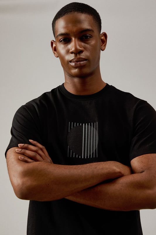 Distinctive eclipse print graphic on the chest for a modern, understated look
        Classic crew neck design offers timeless appeal and everyday comfort
        Short sleeves with clean-finished edges for a neat, polished appearance
        Soft jersey fabric ensures all-day comfort for casual wear
        Versatile regular fit that works well for various body types
    
    This Burton Eclipse Print T-shirt combines simplicity with subtle style, making it a wardrobe essential for the modern man. The minimalist graphic adds interest without overwhelming, perfect for those who appreciate refined details. Style it as shown with olive shorts and trainers for relaxed weekend outings, or pair with dark jeans and a bomber jacket for casual evenings at the pub with mates. The versatile nature of this t-shirt makes it ideal for sporting events, family barbecues, or simply lounging at home. Its clean lines and straightforward design reflect the Burton ethos of practical yet stylish menswear that transitions effortlessly between different casual settings. The cotton jersey fabric ensures breathability and comfort throughout the day, whether you're catching the match or enjoying a countryside walk. A true staple that delivers on both comfort and style.