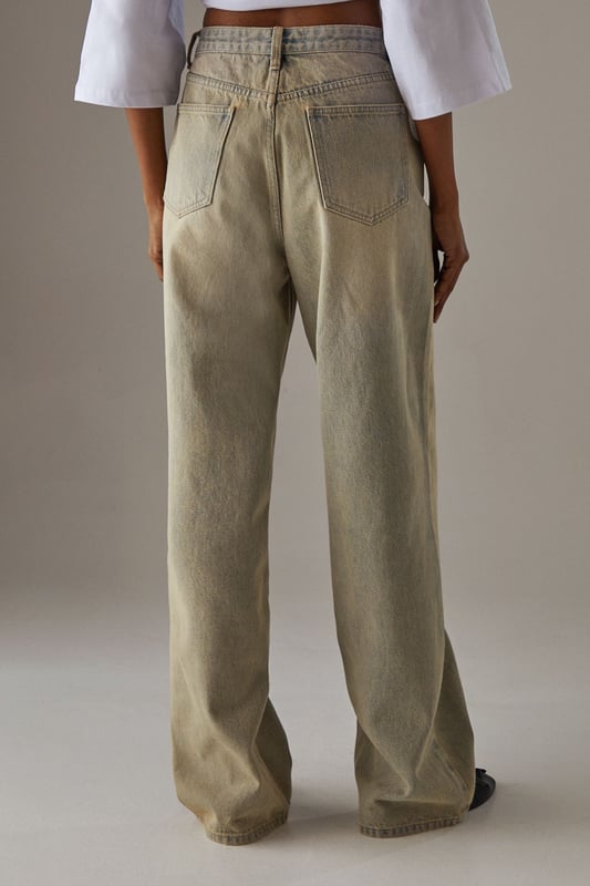 Vintage-inspired boyfriend fit for a relaxed silhouette
        High-rise waist for a flattering and comfortable fit
        Classic five-pocket design for practicality
        Wide leg opening for a trendy, laid-back look
        Distressed wash effect for an authentic, lived-in appearance
    
    Embrace effortless style with these Vintage Wash Ultimate Denim Boyfriend Jeans from Warehouse. Perfect for the confident woman who appreciates edgy yet feminine fashion, these jeans offer a relaxed fit that doesn't compromise on style. The high-rise waist and wide leg opening create a flattering silhouette that pairs beautifully with both casual and dressier tops. For a chic daytime look, team with a crisp white oversized shirt and trainers, as shown. Alternatively, dress them up for an evening out with a silk camisole and heeled mules. The versatile wash makes these jeans ideal for various casual occasions, from weekend brunches to family gatherings. Their relaxed fit ensures all-day comfort without sacrificing that coveted vintage aesthetic, making them a must-have addition to any fashion-forward wardrobe.
