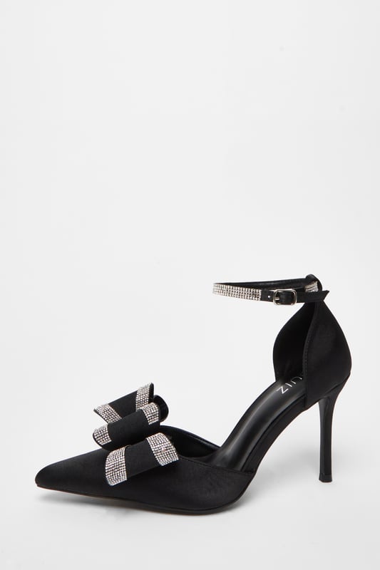 - Satin finish - Ankle strap - Embellished detail - Bow detail - Pointed toe - Court style - Heel height: 9 cm / 3.6" approx