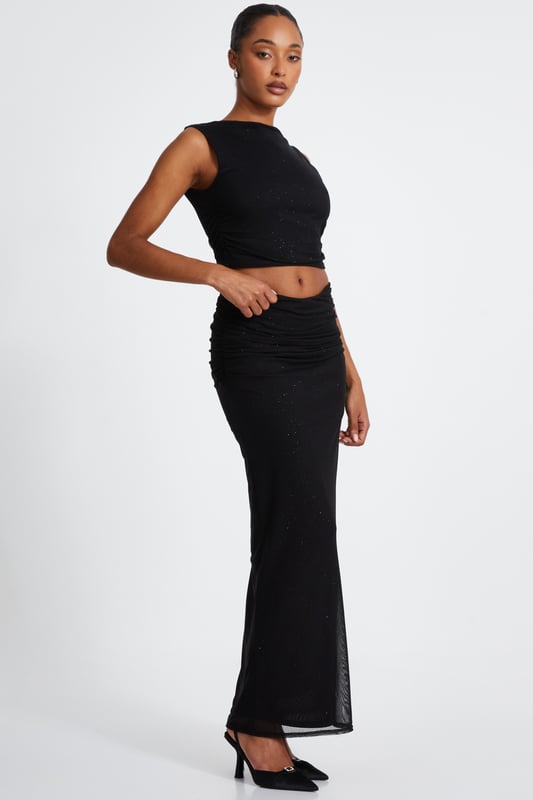 - Glitter mesh finish - Round neckline - Cropped - Sleeveless - Model height: 5'8" - Model wears uk 8 / us 4 / eur 36 - Always check the care wash label - Cool hand wash with mild detergent
