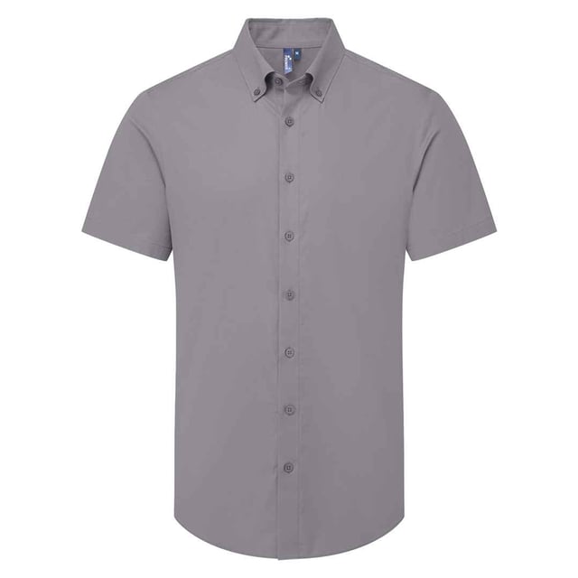 72% Mercerised Cotton, 25% Organic Cotton, 3% Elastane. Fabric: Oxford Cloth, Soft Touch. Design: Plain. Fastening: Button. Neckline: Button-Down. Hem: Curved. Sleeve-Type: Short-Sleeved. Fabric Technology: Stretch. Back Yoke, Pleated Back. 135gsm. Sustainability: Amfori, BSCI, Organic Cotton, Sedex, WRAP Certified.