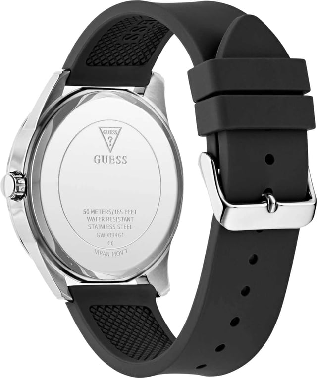 This Guess Elliot Analogue Watch for Men is the perfect timepiece to wear or to gift. It's Silver 44 mm Round case combined with the comfortable Black Silicone watch band will ensure you enjoy this stunning timepiece without any compromise. Operated by a high quality Quartz movement and water resistant to 5 bars, your watch will keep ticking. Sure to be a staple in his watch wardrobe, this new dress style features dynamic detailing on the dial paired with roman numeral indices and a smooth silicone strap. High quality 21 cm length and 21 mm width Black Silicone strap with a Buckle Case diameter: 44 mm,case thickness: 10 mm, case colour: Silver and dial colour: Black