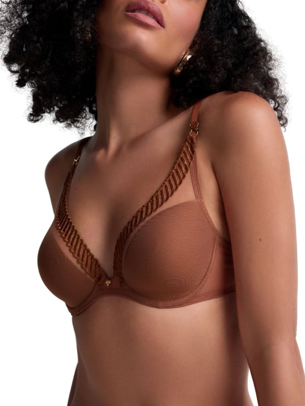 Aubade Sheer Emotion Triangle Plunge Bra. Underwired plunge bra with sheer mesh tulle, a high apex cup shape, lightweight spacer foam cups, and intricate embroidery. Matching briefs available. This item is recommended for hand wash only.