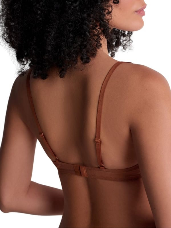 Aubade Sheer Emotion Triangle Plunge Bra. Underwired plunge bra with sheer mesh tulle, a high apex cup shape, lightweight spacer foam cups, and intricate embroidery. Matching briefs available. This item is recommended for hand wash only.