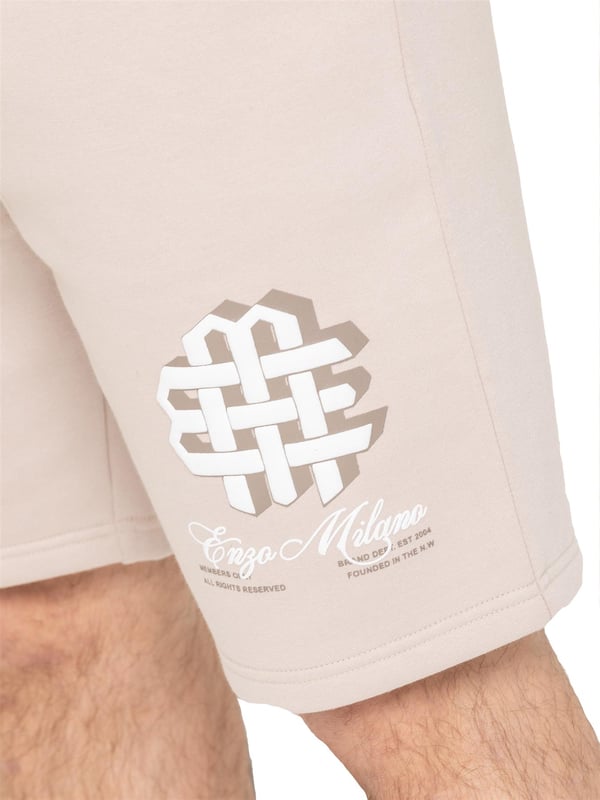 Stay comfortable and stylish with the Enzo Milano Men's Printed Shorts. Featuring a regular fit with soft fleece lining, these shorts are perfect for casual days or relaxed weekends. The elasticated waistband with an adjustable drawstring offers a secure, personalized fit, while two convenient slash pockets provide space for essentials. A bold puff print graphic on the leg adds a standout touch to this everyday staple.(43)