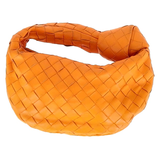 VINTAGE, RRP AS NEW
The Bottega Veneta Mini Jodie in vibrant orange intrecciato leather is the ultimate expression of compact luxury. Its sculptural silhouette and signature woven design make it instantly recognizable, while gold-tone hardware and calfskin lining add refined detail. This top-handle bag is made for effortless impact, from brunch dates to evenings out.

with dust bag

Bottega Veneta Mini Jodie in Orange Leather
Condition: Very good
Signs of wear: No retail tag, Minor sign of wear or markings., Lightly used but very well maintained. Minor creasing, light worn corners, light scratches.
Packaging: Dust bag
Color: Orange
Material: Leather | leather
Size: One Size | One Size
Measurements: Width: 260; Height: 200; Length: 250; Handle drop: 240; Strap length: 0
SKU: NAPPUGBBA475928W