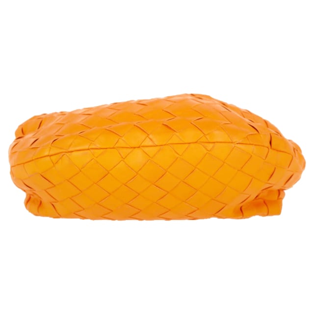 VINTAGE, RRP AS NEW
The Bottega Veneta Mini Jodie in vibrant orange intrecciato leather is the ultimate expression of compact luxury. Its sculptural silhouette and signature woven design make it instantly recognizable, while gold-tone hardware and calfskin lining add refined detail. This top-handle bag is made for effortless impact, from brunch dates to evenings out.

with dust bag

Bottega Veneta Mini Jodie in Orange Leather
Condition: Very good
Signs of wear: No retail tag, Minor sign of wear or markings., Lightly used but very well maintained. Minor creasing, light worn corners, light scratches.
Packaging: Dust bag
Color: Orange
Material: Leather | leather
Size: One Size | One Size
Measurements: Width: 260; Height: 200; Length: 250; Handle drop: 240; Strap length: 0
SKU: NAPPUGBBA475928W