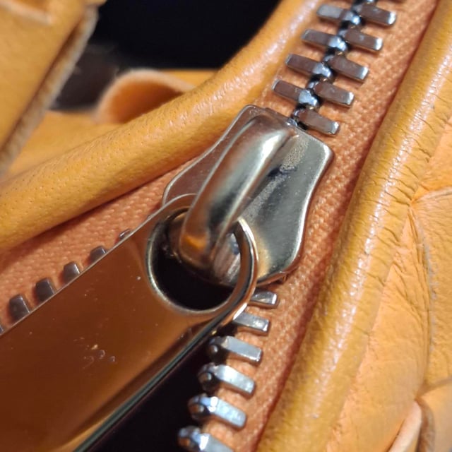 VINTAGE, RRP AS NEW
The Bottega Veneta Mini Jodie in vibrant orange intrecciato leather is the ultimate expression of compact luxury. Its sculptural silhouette and signature woven design make it instantly recognizable, while gold-tone hardware and calfskin lining add refined detail. This top-handle bag is made for effortless impact, from brunch dates to evenings out.

with dust bag

Bottega Veneta Mini Jodie in Orange Leather
Condition: Very good
Signs of wear: No retail tag, Minor sign of wear or markings., Lightly used but very well maintained. Minor creasing, light worn corners, light scratches.
Packaging: Dust bag
Color: Orange
Material: Leather | leather
Size: One Size | One Size
Measurements: Width: 260; Height: 200; Length: 250; Handle drop: 240; Strap length: 0
SKU: NAPPUGBBA475928W