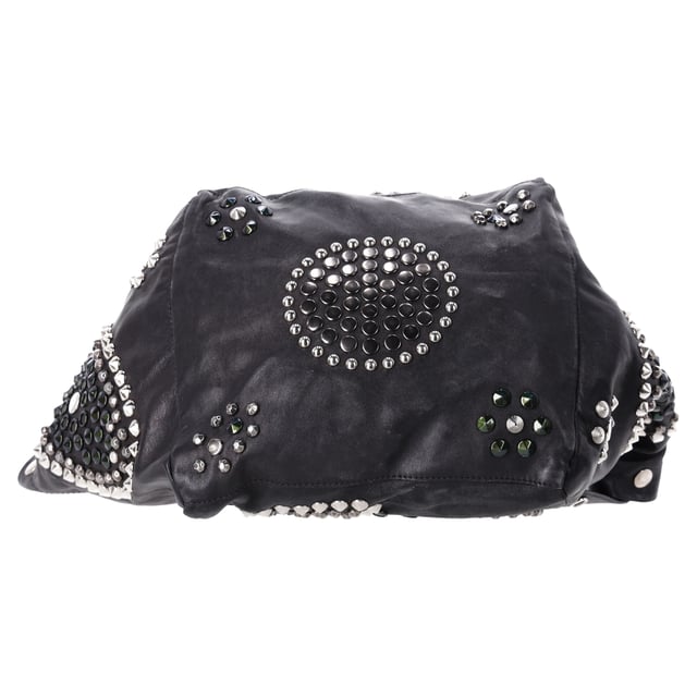VINTAGE, RRP AS NEW
The Jimmy Choo Lola Hobo Bag is where luxury meets edge. Crafted from ultra-soft lambskin leather, this slouchy bag is adorned with bold studs and intricate mosaic pattern cutouts, adding a glamorous twist to an iconic shape. With its relaxed silhouette and attention-grabbing details, it’s a perfect companion for the fashion-forward woman who wants to turn heads wherever she goes.



Jimmy Choo Studded Lola Hobo Bag in Black Lambskin Leather 
Condition: Very good
Signs of wear: No retail tag, Minor sign of wear or markings., 
Packaging: None
Color: black
Material: Leather | leather
Size: One Size | One Size
Measurements: Width: 280; Height: 470; Length: 300; Handle drop: 0; Strap length: 560
SKU: NAPPUDEBA471166W