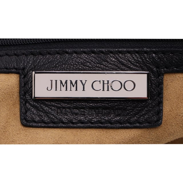 VINTAGE, RRP AS NEW
The Jimmy Choo Lola Hobo Bag is where luxury meets edge. Crafted from ultra-soft lambskin leather, this slouchy bag is adorned with bold studs and intricate mosaic pattern cutouts, adding a glamorous twist to an iconic shape. With its relaxed silhouette and attention-grabbing details, it’s a perfect companion for the fashion-forward woman who wants to turn heads wherever she goes.



Jimmy Choo Studded Lola Hobo Bag in Black Lambskin Leather 
Condition: Very good
Signs of wear: No retail tag, Minor sign of wear or markings., 
Packaging: None
Color: black
Material: Leather | leather
Size: One Size | One Size
Measurements: Width: 280; Height: 470; Length: 300; Handle drop: 0; Strap length: 560
SKU: NAPPUDEBA471166W