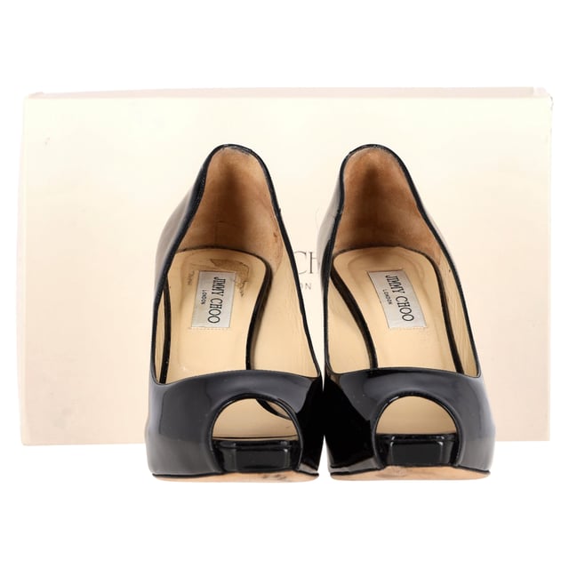 VINTAGE, RRP AS NEW
Turn heads when you glide in any room wearing these Jimmy Choo peep toe pumps. Made from leather, they feature peep toes and 11.5 cm heels. The insoles are leather padded with the brand logos. 

Jimmy Choo Comet Peep Toe Pumps in Black Patent Leather 
Condition: Very good
Signs of wear: Include Box., Minor markings, Lightly used but very well maintained. Minor mark at soles & creasing, light scuffing at the soles and heels.
Packaging: Box
Color: black
Material: Leather | patent leather
Size: EU | 39
Measurements: Heel height: 100; Insole length: 270
SKU: NAPPUGBSH474226W
