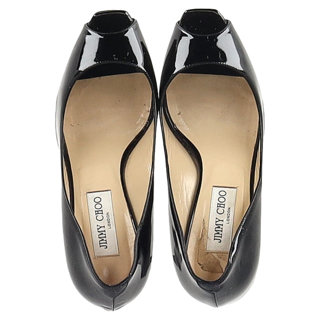 VINTAGE, RRP AS NEW
Turn heads when you glide in any room wearing these Jimmy Choo peep toe pumps. Made from leather, they feature peep toes and 11.5 cm heels. The insoles are leather padded with the brand logos. 

Jimmy Choo Comet Peep Toe Pumps in Black Patent Leather 
Condition: Very good
Signs of wear: Include Box., Minor markings, Lightly used but very well maintained. Minor mark at soles & creasing, light scuffing at the soles and heels.
Packaging: Box
Color: black
Material: Leather | patent leather
Size: EU | 39
Measurements: Heel height: 100; Insole length: 270
SKU: NAPPUGBSH474226W