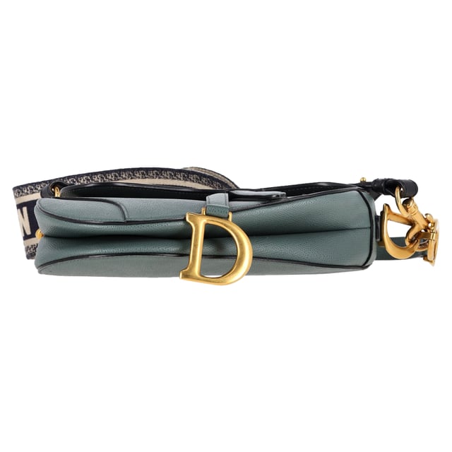 VINTAGE, RRP AS NEW
Maria Grazia Chiuri brings a fresh perspective to the legendary Dior Saddle Bag with this stunning update, crafted in luxurious blue calfskin. The unmistakable Saddle flap features a D stirrup strap with a magnetic pull closure, while antique gold-finish CD signatures on either side of the top handle add a refined touch. With a logo detailed, adjustable, and removable shoulder strap, this versatile bag can be carried by hand, worn over the shoulder, or styled crossbody. Inside, you’ll find a spacious interior pocket and a convenient back pocket, offering both elegance and practicality.


Dior Saddle Bag in Blue Leather
Condition: Excellent
Signs of wear: No retail tag, No visible sign of wear., 
Packaging: None
Color: blue
Material: Leather | leather
Size: One Size | One Size
Measurements: Width: 60; Height: 190; Length: 240; Handle drop: 200; Strap length: 600
SKU: NAPPUGBBA468291W