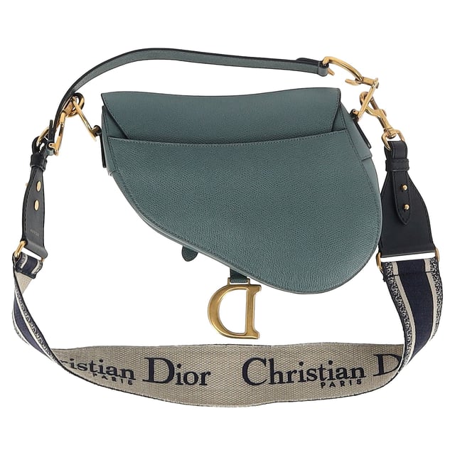 VINTAGE, RRP AS NEW
Maria Grazia Chiuri brings a fresh perspective to the legendary Dior Saddle Bag with this stunning update, crafted in luxurious blue calfskin. The unmistakable Saddle flap features a D stirrup strap with a magnetic pull closure, while antique gold-finish CD signatures on either side of the top handle add a refined touch. With a logo detailed, adjustable, and removable shoulder strap, this versatile bag can be carried by hand, worn over the shoulder, or styled crossbody. Inside, you’ll find a spacious interior pocket and a convenient back pocket, offering both elegance and practicality.


Dior Saddle Bag in Blue Leather
Condition: Excellent
Signs of wear: No retail tag, No visible sign of wear., 
Packaging: None
Color: blue
Material: Leather | leather
Size: One Size | One Size
Measurements: Width: 60; Height: 190; Length: 240; Handle drop: 200; Strap length: 600
SKU: NAPPUGBBA468291W