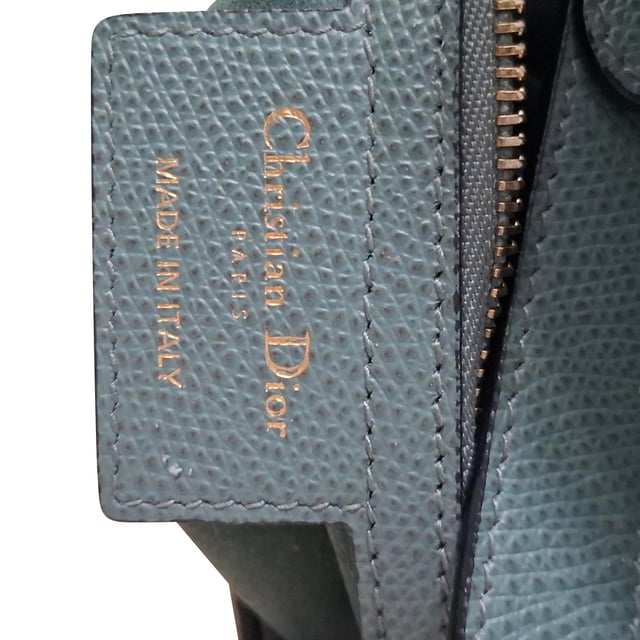 VINTAGE, RRP AS NEW
Maria Grazia Chiuri brings a fresh perspective to the legendary Dior Saddle Bag with this stunning update, crafted in luxurious blue calfskin. The unmistakable Saddle flap features a D stirrup strap with a magnetic pull closure, while antique gold-finish CD signatures on either side of the top handle add a refined touch. With a logo detailed, adjustable, and removable shoulder strap, this versatile bag can be carried by hand, worn over the shoulder, or styled crossbody. Inside, you’ll find a spacious interior pocket and a convenient back pocket, offering both elegance and practicality.


Dior Saddle Bag in Blue Leather
Condition: Excellent
Signs of wear: No retail tag, No visible sign of wear., 
Packaging: None
Color: blue
Material: Leather | leather
Size: One Size | One Size
Measurements: Width: 60; Height: 190; Length: 240; Handle drop: 200; Strap length: 600
SKU: NAPPUGBBA468291W