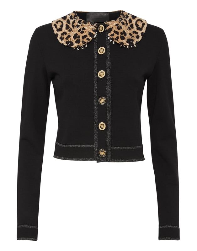 Gebreid viscose jasje met een lurex gedempte kraag. Juweelknopen.