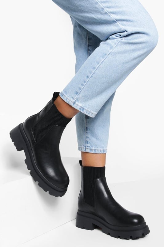 Chunky sole design for a bold, contemporary look
        Elastic side panels for easy slip-on and off
        Flat heel height between 0 and 2cm for all-day comfort
        Durable synthetic materials for long-lasting wear
        Wide fit to accommodate various foot shapes
    
    Step out in style with these wide fit chunky sole Chelsea boots, perfect for the fashion-forward trendsetter. The robust design combines practicality with edgy appeal, making them a versatile addition to your footwear collection. Pair them with cropped jeans and an oversized jumper for a casual daytime look, or dress them up with a flowy midi dress and leather jacket for an evening out. These boots are ideal for various casual occasions, from family gatherings to weekend brunches with friends. The flat heel ensures comfort for extended wear, while the wide fit caters to those seeking a roomier option. Embrace the street-style aesthetic and make a statement with every step in these eye-catching boots that effortlessly blend comfort and contemporary fashion.