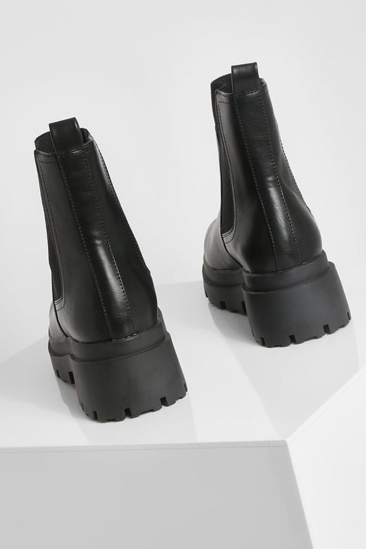 Chunky sole design for a bold, contemporary look
        Elastic side panels for easy slip-on and off
        Flat heel height between 0 and 2cm for all-day comfort
        Durable synthetic materials for long-lasting wear
        Wide fit to accommodate various foot shapes
    
    Step out in style with these wide fit chunky sole Chelsea boots, perfect for the fashion-forward trendsetter. The robust design combines practicality with edgy appeal, making them a versatile addition to your footwear collection. Pair them with cropped jeans and an oversized jumper for a casual daytime look, or dress them up with a flowy midi dress and leather jacket for an evening out. These boots are ideal for various casual occasions, from family gatherings to weekend brunches with friends. The flat heel ensures comfort for extended wear, while the wide fit caters to those seeking a roomier option. Embrace the street-style aesthetic and make a statement with every step in these eye-catching boots that effortlessly blend comfort and contemporary fashion.