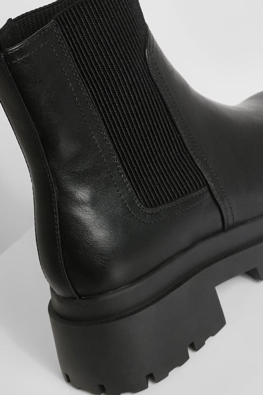 Chunky sole design for a bold, contemporary look
        Elastic side panels for easy slip-on and off
        Flat heel height between 0 and 2cm for all-day comfort
        Durable synthetic materials for long-lasting wear
        Wide fit to accommodate various foot shapes
    
    Step out in style with these wide fit chunky sole Chelsea boots, perfect for the fashion-forward trendsetter. The robust design combines practicality with edgy appeal, making them a versatile addition to your footwear collection. Pair them with cropped jeans and an oversized jumper for a casual daytime look, or dress them up with a flowy midi dress and leather jacket for an evening out. These boots are ideal for various casual occasions, from family gatherings to weekend brunches with friends. The flat heel ensures comfort for extended wear, while the wide fit caters to those seeking a roomier option. Embrace the street-style aesthetic and make a statement with every step in these eye-catching boots that effortlessly blend comfort and contemporary fashion.