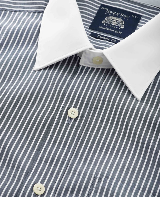 Black and white striped formal shirt with contrast white collar and cuffs. Crafted from the smoothest cotton and cut to our spacious classic fit. Contrast white curl resistant Windsor collar, with an integral and removable collar stay. 100% BCI cotton poplin; smooth to the touch. Generously proportioned classic fit. Curl resistant Windsor contrast white collar and double cuffs. Split yoke, long tails, chest pocket. Machine washable at 40°C. Shirt is presented in fully recyclable packaging.