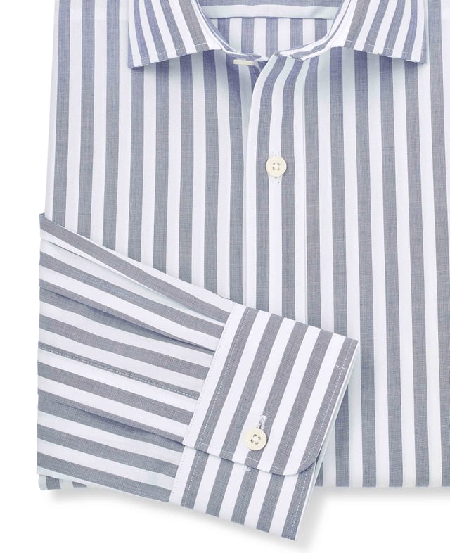This navy and white striped shirt will bring a fresh feel to your formal ensembles. Cut to a slim fit shape with a curl-resistant collar, it can be worn with or without a tie. 100% BCI smooth cotton poplin; silk protein easy-care finish. A flattering, gently tapered fit for all builds. Curl resistant cutaway collar, with an integral and removable collar stay. Pucker-free french taped armhole seams. Split yoke, two back darts. Machine washable at 40°C. Presented in fully recyclable packaging.